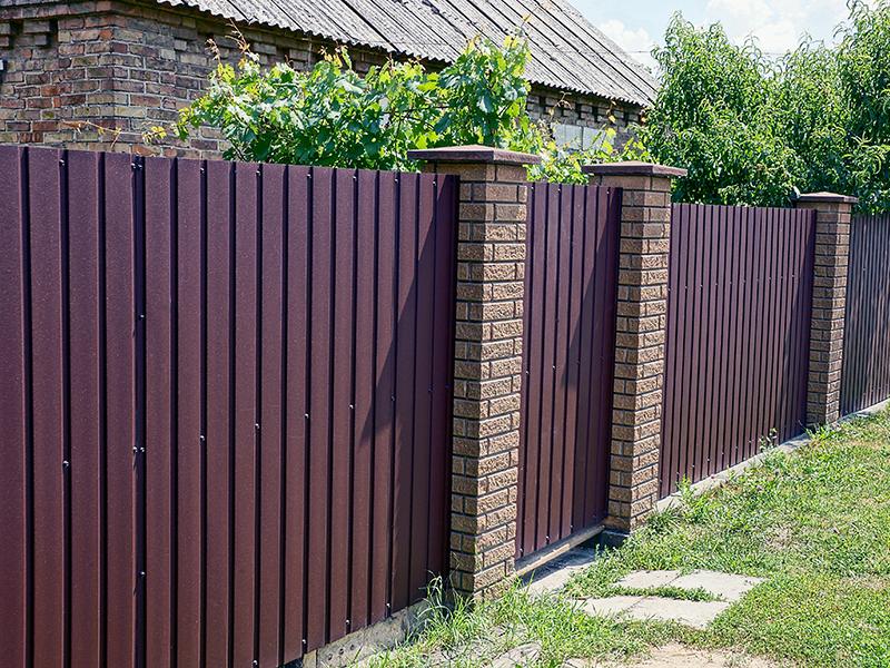 85007580 - brown fence and closed door on the street